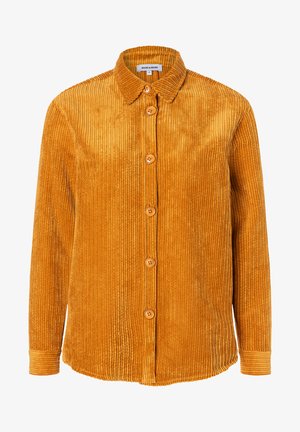 Corduroy shirt in mustard yellow, featuring a collar, button front, and long sleeves with ribbed texture and five wooden buttons.