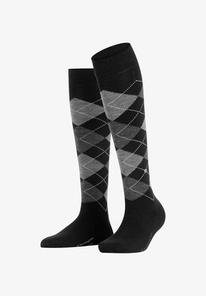 Zwart en grijze argyle sokken tot de knie met een ruitpatroon en witte stiksels; gemaakt van zachte, rekbare stof.