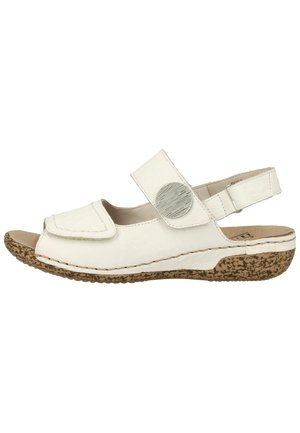 Weiße Leder-Sandale mit offenem Zehendesign, verstellbarem Riemen, kreisförmigem Akzent und einer strukturierten Korksohle für Grip und Komfort.