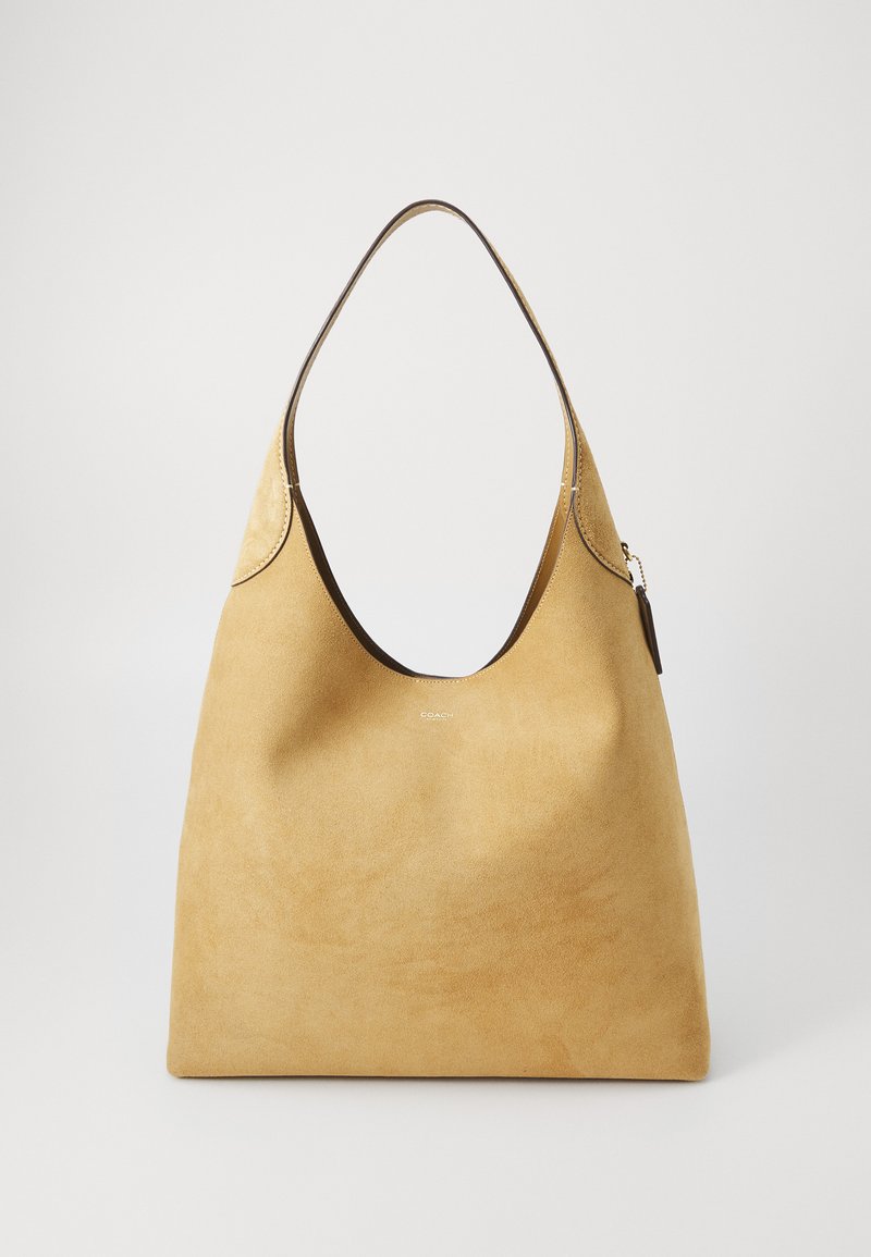 Yellow suede hobo bag with a smooth texture, wide opening, and a brown leather trim along the top. Features a silver-tone zipper pull.