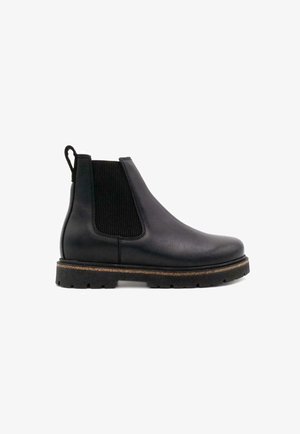 Black leather Chelsea boot with elastic side panels, textured fabric accents, and a sturdy black rubber sole. Compact design with pull tab.