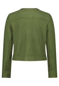 Dark green cropped jacket with long sleeves, textured fabric, and minimal stitching details along the seams and shoulders.