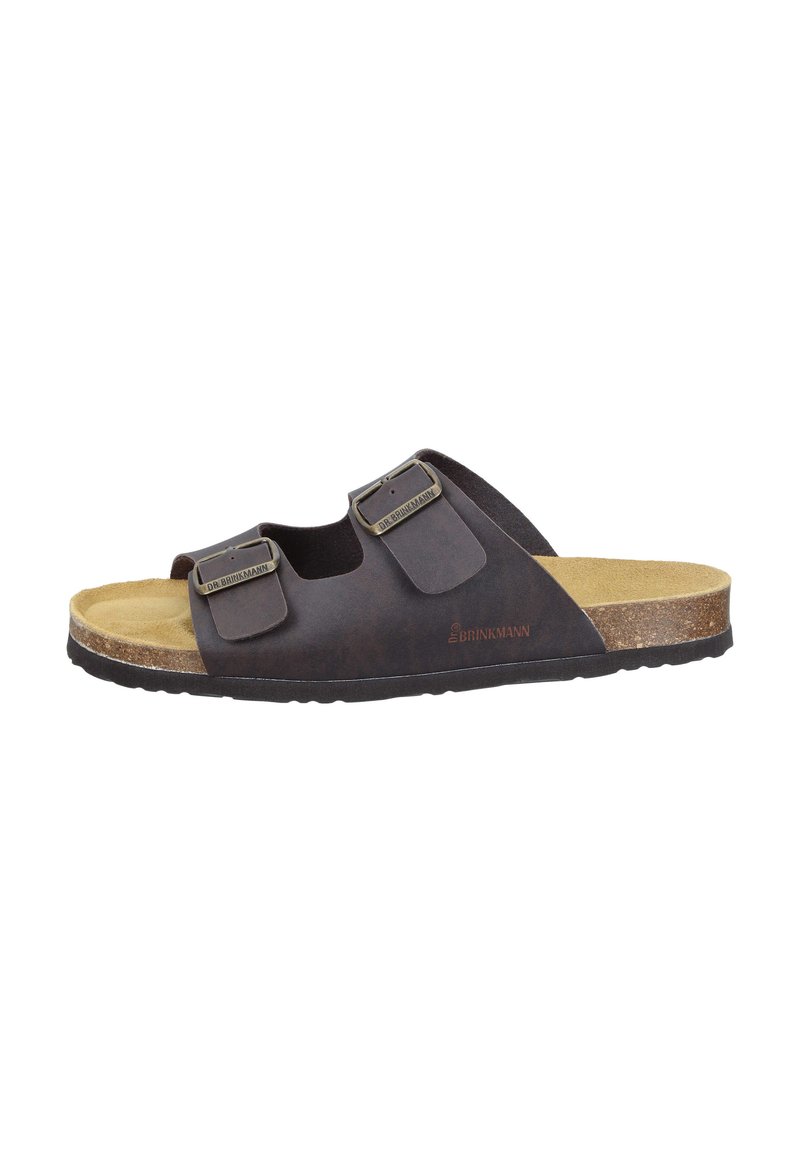 Sandale en cuir synthétique marron foncé avec deux sangles ajustables, semelle en liège et semelle en caoutchouc texturé. Accents en matériel de couleur bronze.