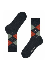 Ciemnoszare skarpetki z wzorem argyle w czerwonym, zielonym i czarnym kolorze, z kontrastującymi białymi rombami oraz logo nadrukowanym na podeszwie.