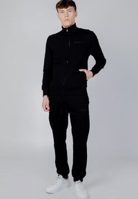 GAS LUSTIG POCKET - Sweater met rits - black