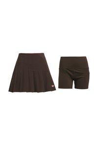 Brown pleated skirt with a red waistband and logo, paired with matching brown fitted shorts. Both made from a smooth, stretchy fabric.