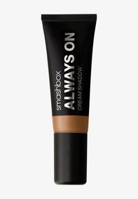 Tube noir de Smashbox Always On Cream Shadow avec une finition mate, un fond brun cuivré et un texte argenté sur le corps.