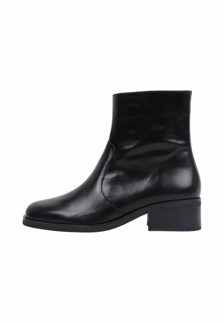 Black leather ankle boot with a rounded toe, minimal stitching, and a low block heel. Smooth texture with a shiny finish.
