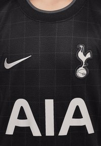 Maglia da calcio nera in tessuto testurizzato, con motivo a griglia, logo Nike argento e testo "AIA" bianco. Include un'emblema del club.