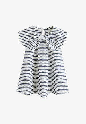 Bela in mornarsko modra otroška obleka z velikim lokom spredaj in rokavi z rahlim nabiranjem.