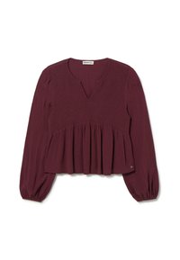 Blouse bordeaux avec un décolleté en V, un corsage smocké et un peplum évasé. Manches longues avec des poignets élastiques, fabriquée à partir d'un tissu texturé.