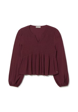 Blusa burdeos con escote en V, cuerpo fruncido y peplum acampanado. Mangas largas con puños elásticos, hecha de una tela texturizada.