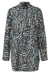 Chemise noire à manches longues, présentant un motif abstrait coloré en blanc, turquoise et orange sur un fond sombre.
