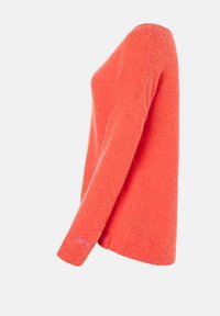 Helle orange Pullover mit langen Ärmeln, aus weichem, strukturiertem Stoff. Verfügt über dezente Stickerei am Saum und einen insgesamt lockeren Schnitt.