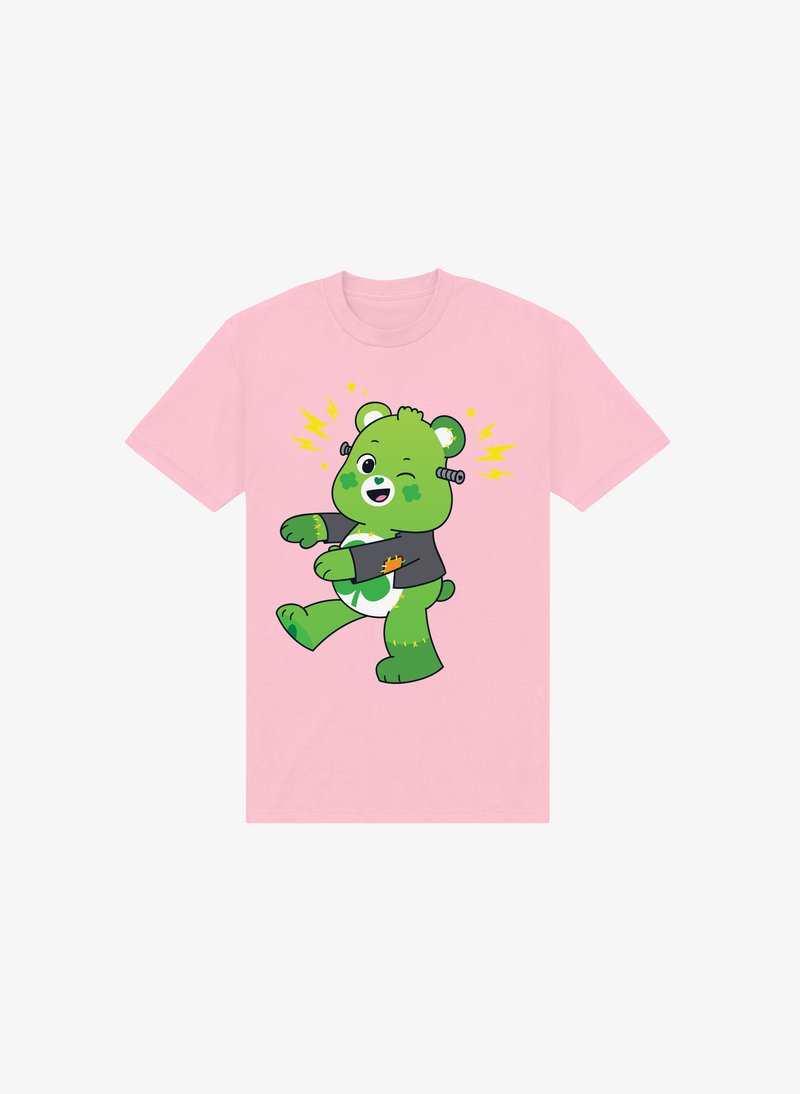 Różowa koszulka z rysunkowym zielonym niedźwiedziem z mechanicznymi detalami, w czarnej kurtce, stojącym w zabawnej pozie.