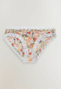 Sous-vêtements bikini transparents avec bordure en dentelle blanche et motif fruité coloré sur fond clair.