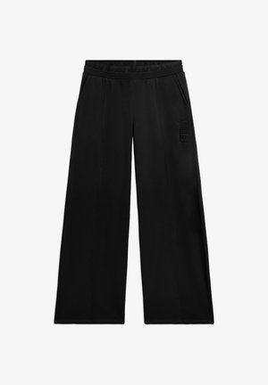 Pantaloni neri a gamba larga con tasche laterali, vita elastica e logo "FREDDY" sulla coscia destra.