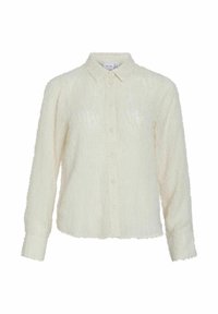Camisa blanca de botones con textura y manga larga, que presenta un cuello con solapa y un acabado de tejido suave y esponjoso.
