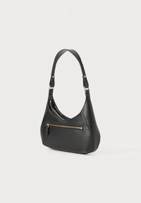 Black leather hobo bag with a curved shape, a single shoulder strap, and a front zip pocket with gold-tone hardware accents.