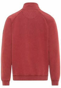 Sweat-shirt rouge à col rond avec un ourlet et des poignets côtelés, fabriqué dans un tissu doux. Dispose de manches raglan et d'un logo subtil sur la manche.