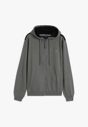 Sudadera con capucha gris con cremallera, que presenta un detalle negro en los hombros, dos bolsillos delanteros, cordones y una textura suave y lisa.