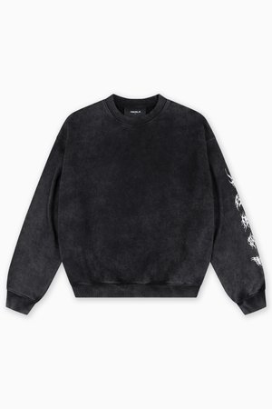 Zwarte sweatshirt met lange mouwen, ronde hals en ribbelmanchetten. Beschikt over een geweven stof en ingewikkelde witte grafische details op de mouw.