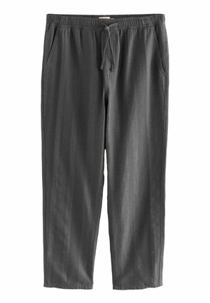 Pantalons légers gris avec une taille élastique et un cordon de serrage. Dispose de poches latérales et d'un tissu texturé avec des rayures verticales.