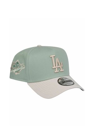 Mint green cap with a white brim. Features embroidered LA logo and decorative stitching. Made of textured fabric. New Era tag visible.
