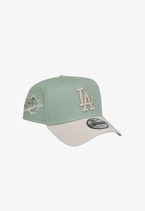 Mint green cap with a white brim. Features embroidered LA logo and decorative stitching. Made of textured fabric. New Era tag visible.