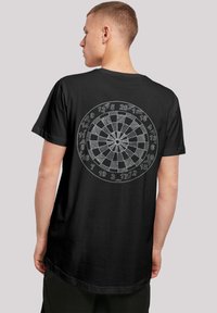 Black cotton t-shirt featuring a circular dartboard graphic on the back, with white lines representing numbers and sections.