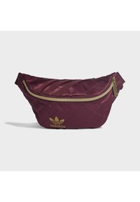 Maroon quilted fanny pack featuring a gold zipper and Adidas logo. Made from smooth material, with a curved shape and adjustable strap.