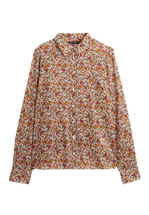 Chemise à manches longues boutonnée avec col, présentant un motif floral dense en rouge, orange, marron et vert sur un fond beige clair.