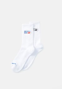 White ribbed socks featuring blue and black "New Balance Athletic Shoes" logos. Fabric is soft and flexible with a crew length design.