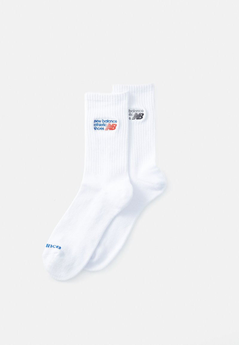 White ribbed socks featuring blue and black "New Balance Athletic Shoes" logos. Fabric is soft and flexible with a crew length design.