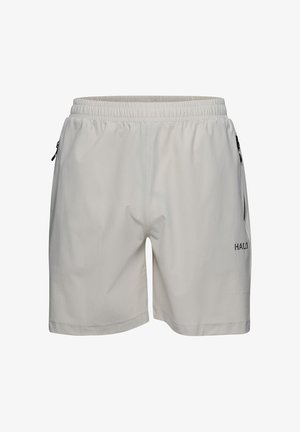 Helle graue Sportshorts mit einem elastischen Bund, ausgestattet mit zwei seitlichen Reißverschlusstaschen und einem strukturierten Stoff. "HALO"-Logo auf der unteren rechten Seite.