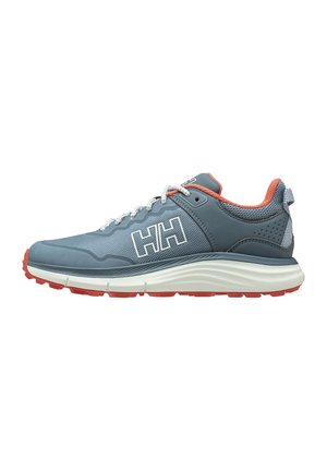Scarpa da ginnastica atletica grigia e arancione con lacci bianchi, logo "HH" bianco sul lato e suola in gomma rossa, vista di profilo rivolta verso sinistra.