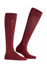 Calze al ginocchio in bordeaux con una texture liscia, punte rinforzate e un polsino a coste per comfort e vestibilità sicura.