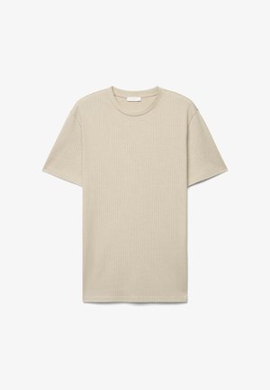 Beige short-sleeve crew neck T-shirt with subtle woven zigzag pattern, displayed flat on a white background.