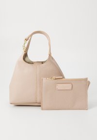 Light pink leather handbag with a textured finish, featuring a short handle and a small matching wallet with a gold zipper and label.