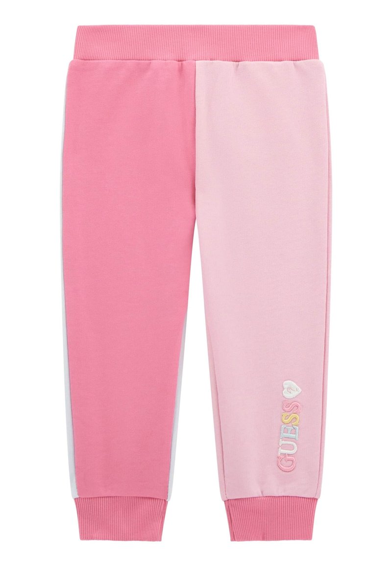 Rosa och ljusrosa sweatpants med ribbat midjeband, smalnande ärmslut och "GUESS" broderat i flerfärgat på benet.