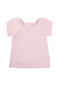 Jasnoróżowy, krótki t-shirt z miękkiej tkaniny, okrągłym dekoltem i dwoma zatrzaskami na ramieniu, które ułatwiają zakładanie.