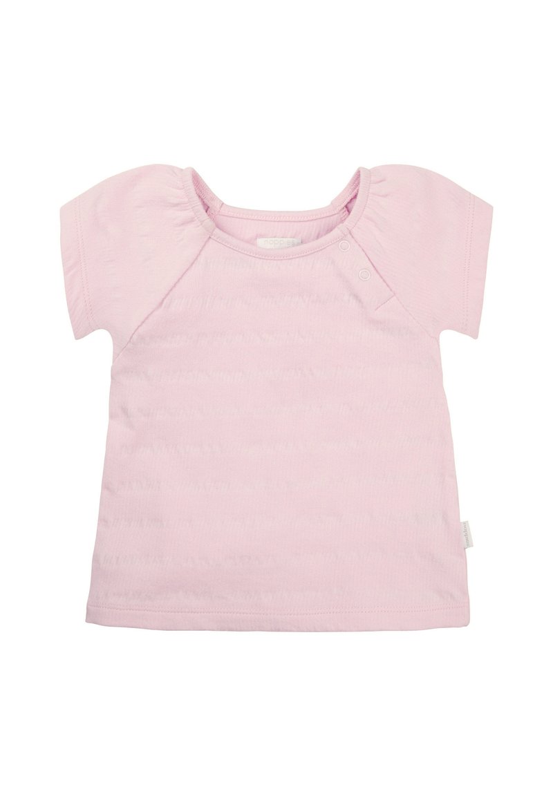 Jasnoróżowy, krótki t-shirt z miękkiej tkaniny, okrągłym dekoltem i dwoma zatrzaskami na ramieniu, które ułatwiają zakładanie.