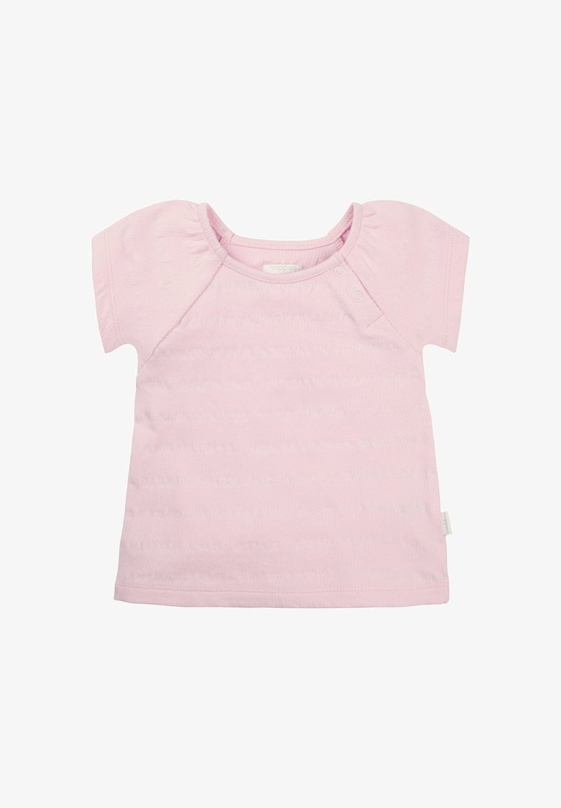 Jasnoróżowy, krótki t-shirt z miękkiej tkaniny, okrągłym dekoltem i dwoma zatrzaskami na ramieniu, które ułatwiają zakładanie.