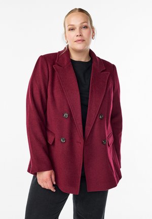 Burgundy double-breasted blazer made of wool blend, featuring a notched lapel, two front pockets, and black buttons for closure.
