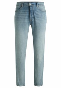Jasnoniebieskie dżinsy o dopasowanym kroju, z pięcioma kieszeniami, szlufkami na pasek i zamkiem błyskawicznym. Materiał ma lekko wyblakłą teksturę.