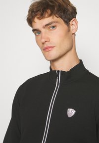EA7 Emporio Armani Jaka ar rāvējslēdzēju - nero