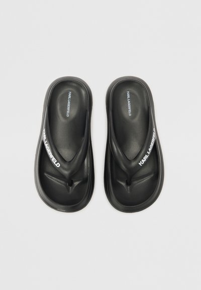 Tongs noires avec un design moulé, semelle intérieure texturée et branding "KARL LAGERFELD" en blanc sur les sangles supérieures. Matériau en plastique lisse.