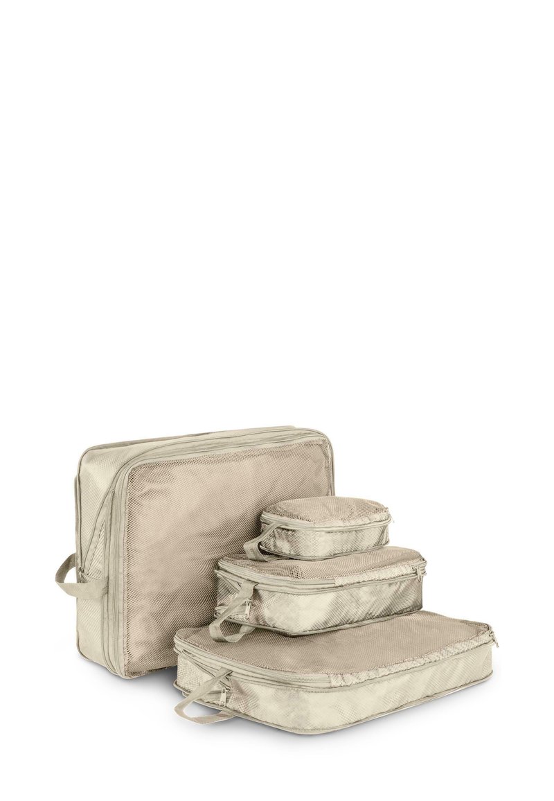 Set aus vier Reisekompressionstaschen aus weichem, cremefarbenem Stoff. Enthält eine große und drei kleinere Taschen, alle mit Reißverschlüssen und Griffen.