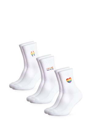 Three pairs of white crew socks each with a different rainbow design: two people, the word LOVE, and a heart.