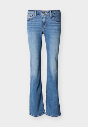 Light blue denim jeans with a slight flare at the bottom, classic five-pocket design, and button closure at the waist.
